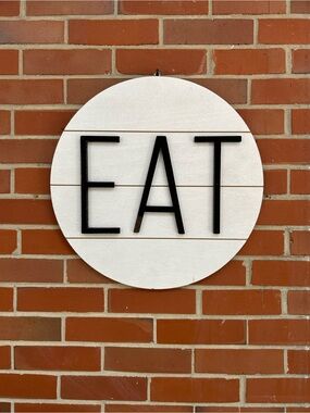 Lg Wooden Round White Wall Sign w/Black EAT Letters, perfect for kitchen decor!